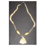 Beaded Necklace with Decorative Pendant