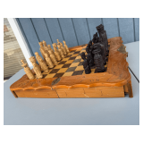 Carved Wooden Figural Chess Set with Integrated Storage Board