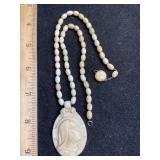 Virgin Mary Carved Material ? Marked 10k Gold