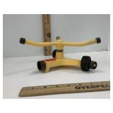 Vintage Yellow Rotating Sprinkler