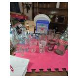 Sixteen coca cola collectibles glasses bottles