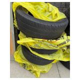 Stack of four 235 65 R16C tires