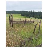 Antique horse-drawn dump rake, and disk harrow.