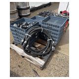 Pallet of dishwasher trays and hoses