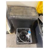 Trash can and crate of electrical
