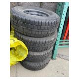 Stack of four 235 75 R15 Studded on Rims