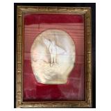 Carved shell picture of a fisherman