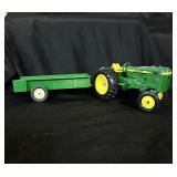Vintage John Deere tractor with trailer
