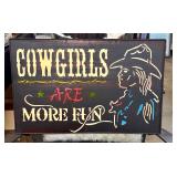 Metal and enamel cowgirl sign