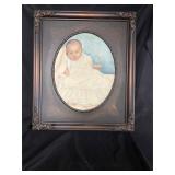 Antique picture frame portrait of a baby
