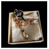 Altas brooch with tags