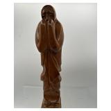 Praying monk figure