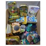 Pokï¿½mon trading coins  & empty tin cases