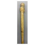 Carved stone figural hair or cloak pin