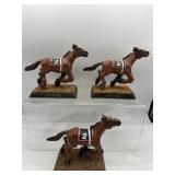 Affirmed racing horses with bobble heads