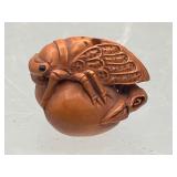 Signed and carved .5' grasshopper netsuke