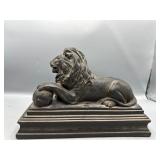 resting lion statue