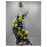 Crescent moon bottle with marbles