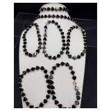 7 onyx and 14 K gold bracelets