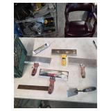 Milk crate full of drywall tools. 4-50