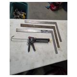 3 steel carpenters squares and caulk gun. 4-149