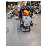 Miller arc welder with leads & welding cart. 4-100