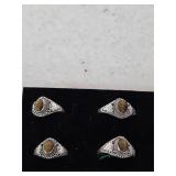 4 sterling silver rings. see pics for size. 25-42