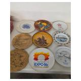 Brass, ceramic, and wood collectors' plates. 45-47