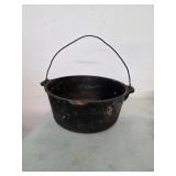 12in diameter cast iron pot. 25-26