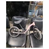 Toddlers scooting bike. 24-13