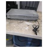 VHS and DVD player. 12-54