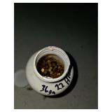 Large pill bottle full of .22 LR rounds. 4-14