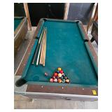 Pool table with balls and cues. lot 96