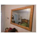 Large, ornate gold leaf wall mirror. D350