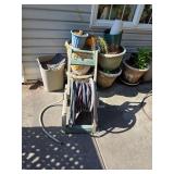 Gardening pots and hose. D633