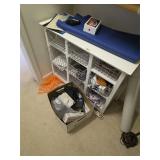 Shelving unit with contents and box. D464