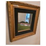 Gold filigree framed mirror. D368