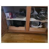 Cast iron pots, toaster, colanders. D65