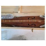 Dulcimer in wooden case. 1-38