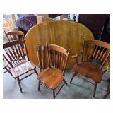 Table with 2 leaves and 6 chairs. 55-69