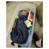 Large tub of clothes and books. 55-81