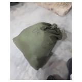 Vintage military bag full of military items. 55-89