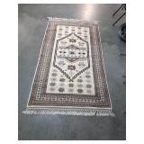 86in long by 4ft wide handmade rug. 7-1