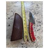 8in Damascus blade with gut hook and sheath. M12