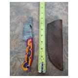 8in Damascus blade with gut hook and sheath. M10