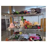 3 shelves of Halloween decorations and more. 93-1