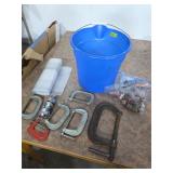 Clamps and copper in bucket. 20-22