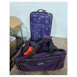 Purple luggage lot with wrestling gear. 55-9