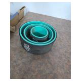 Nested teal and black yoga wheels. 40-63