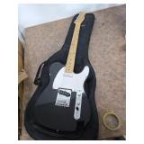Squire electric guitar with padded case. 40-12